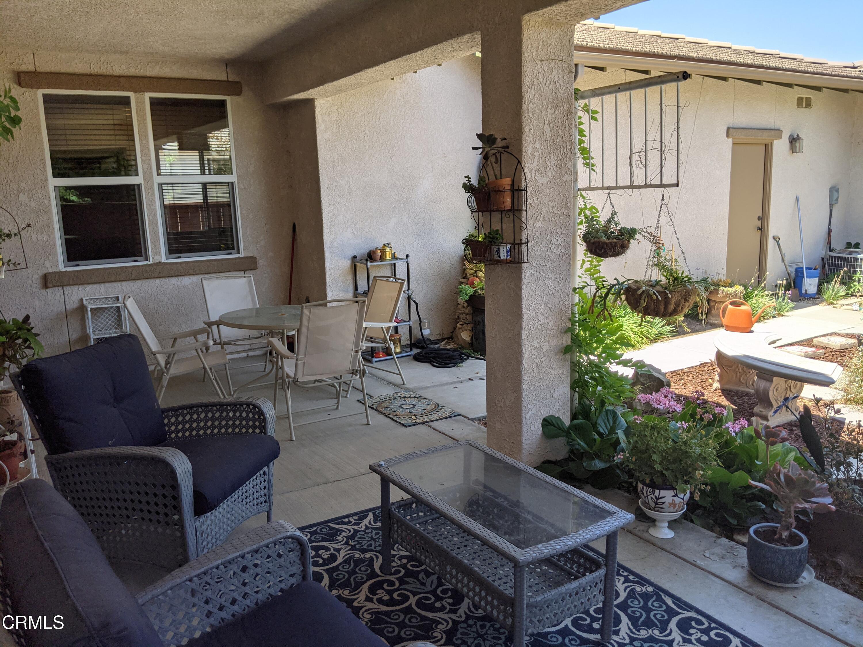2654 Traditions Loop Paso Robles, CA 93446 - Photo 11 of 32 a outdoor living space with furniture and a potted plant