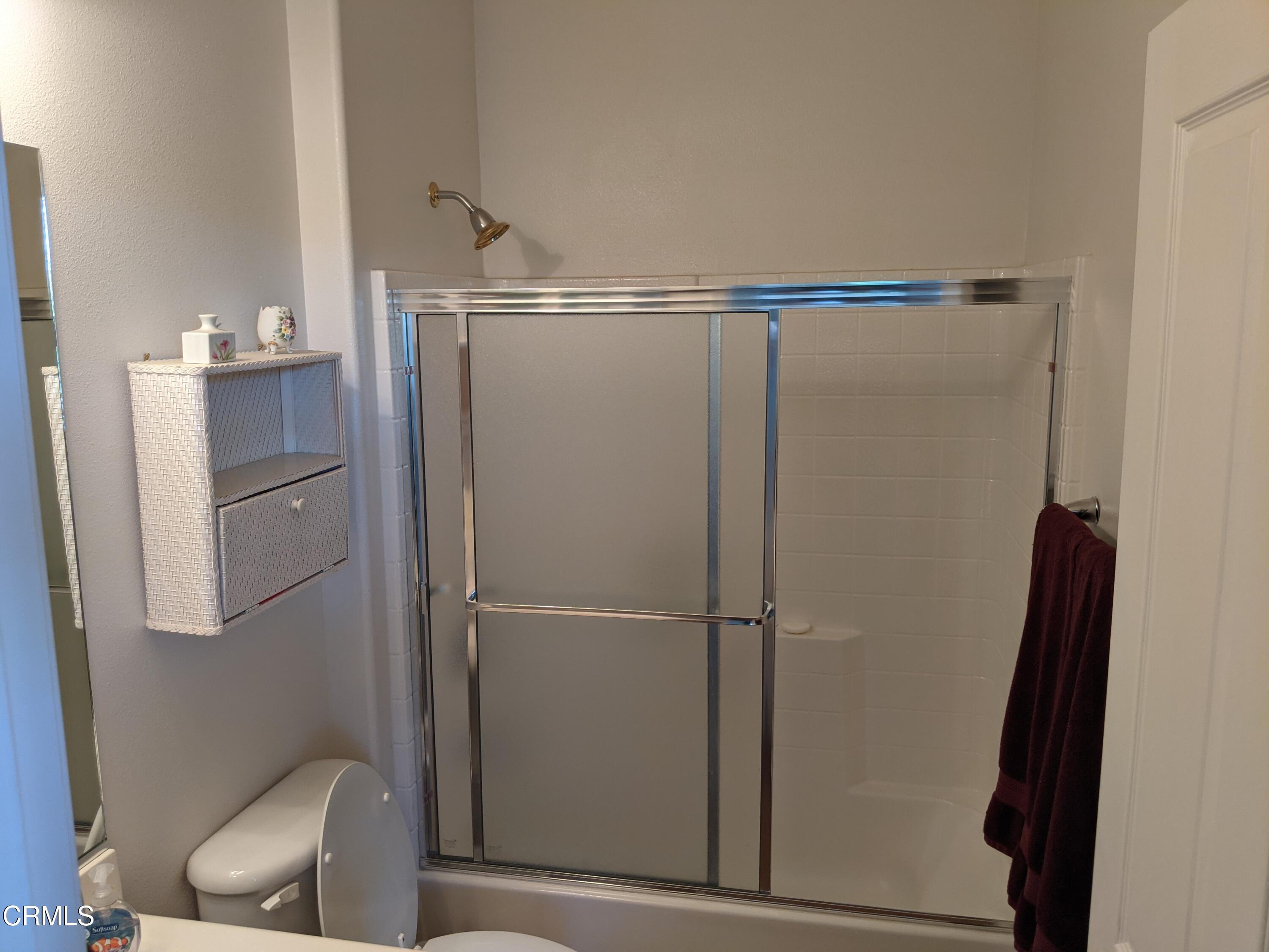 2654 Traditions Loop Paso Robles, CA 93446 - Photo 5 of 32 a bathroom with a shower