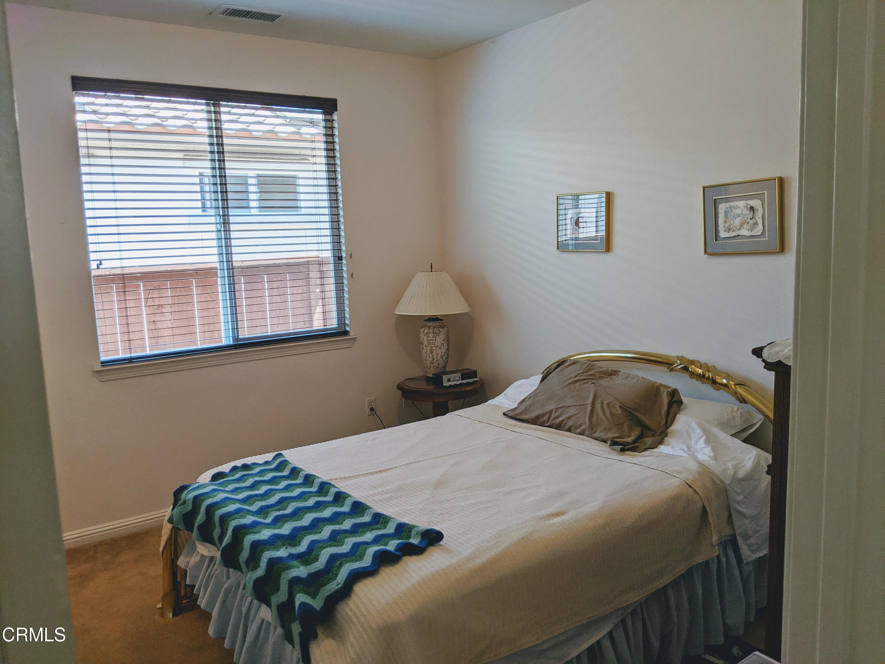 2654 Traditions Loop Paso Robles, CA 93446 - Photo 6 of 32 a bedroom with a bed and a window