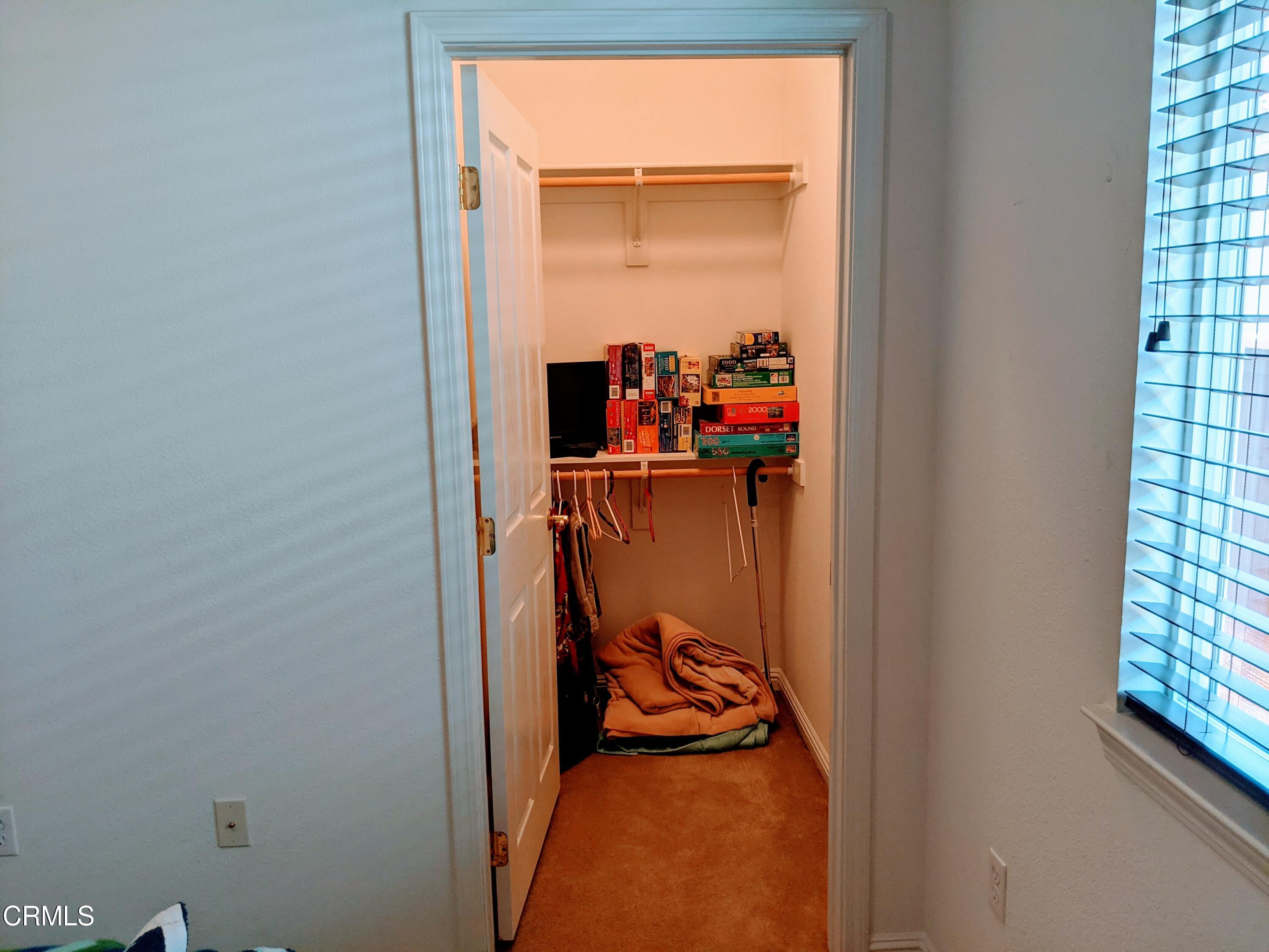 2654 Traditions Loop Paso Robles, CA 93446 - Photo 7 of 32 a view of walk in closet with clothes and shoes