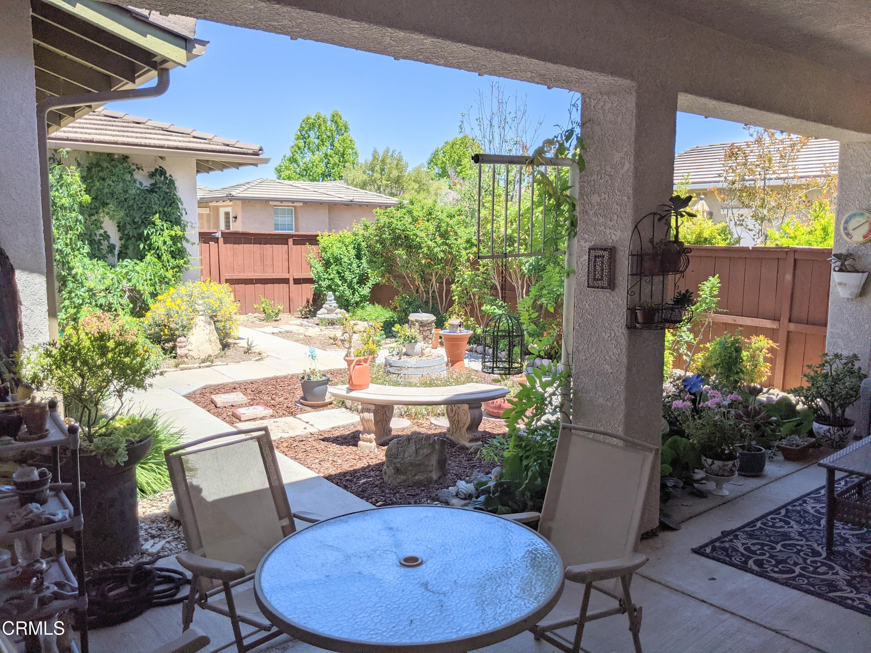 2654 Traditions Loop Paso Robles, CA 93446 - Photo 9 of 32 a outdoor dining space with furniture and garden