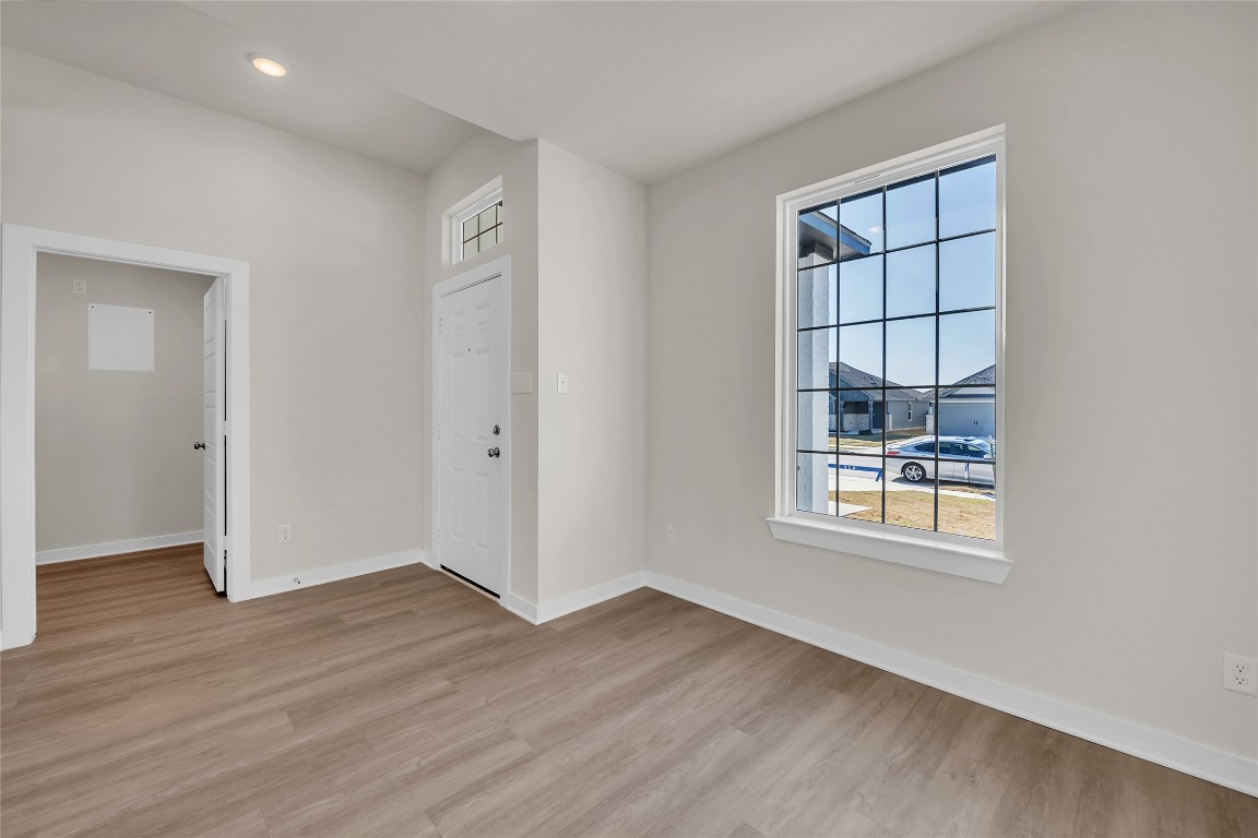121 Walk Way Jarrell, TX 76537 - Photo 26 of 29 Spare room with recessed lighting, baseboards, and light wood finished floors