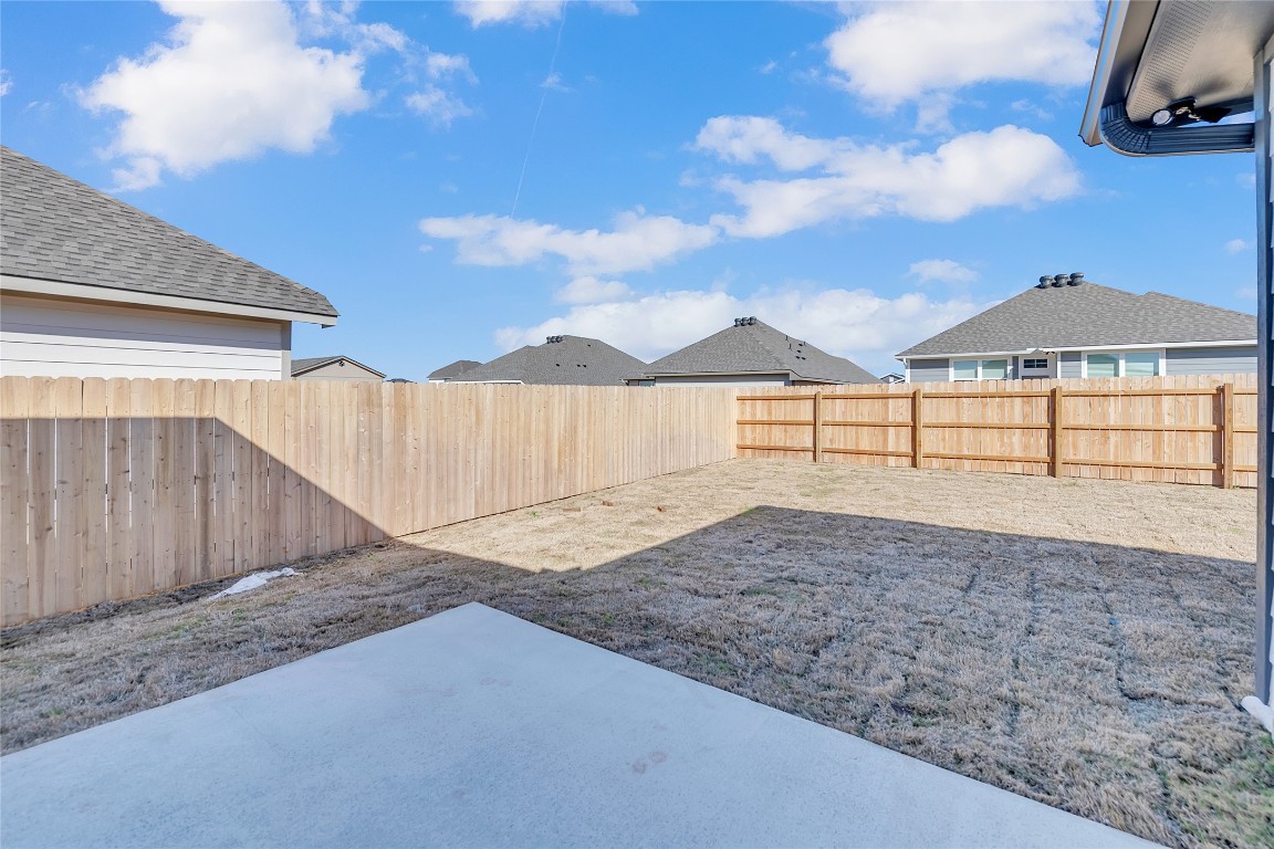 121 Walk Way Jarrell, TX 76537 - Photo 28 of 29 View of yard with a patio and a fenced backyard
