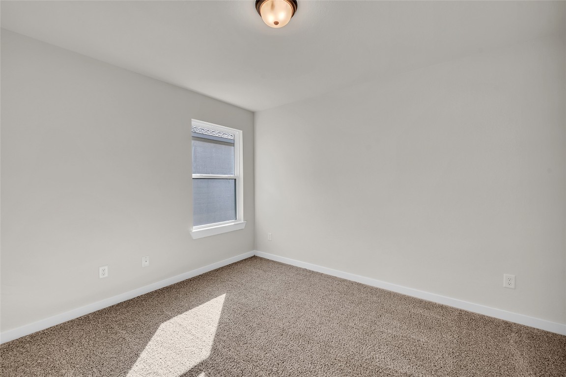121 Walk Way Jarrell, TX 76537 - Photo 6 of 29 Carpeted empty room featuring baseboards