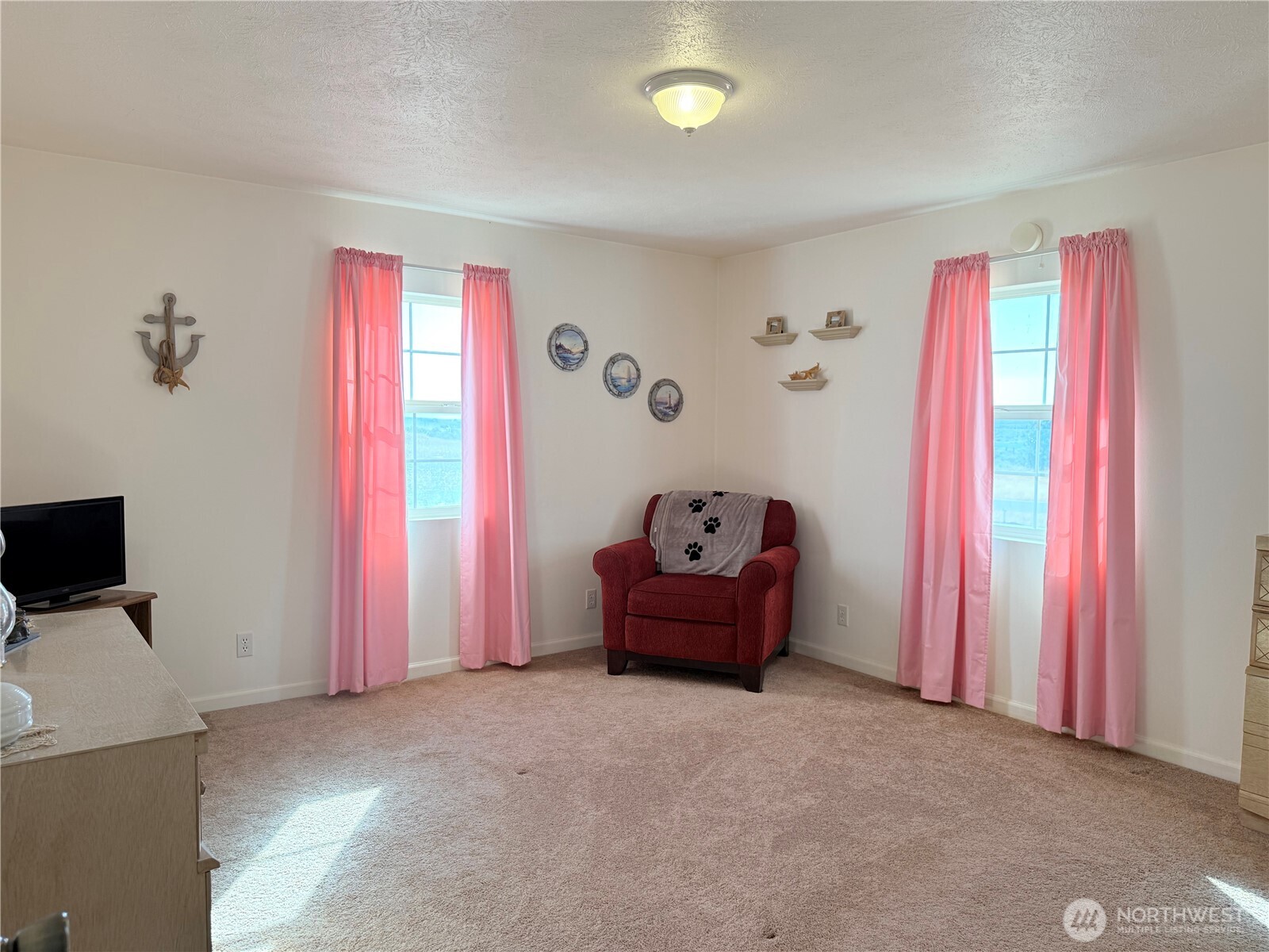 15977 Laney Bros Road East Odessa, WA 99159 - Photo 12 of 33 a bed room with a bed and a television