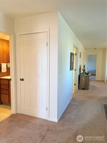 a view of a livingroom with kitchen