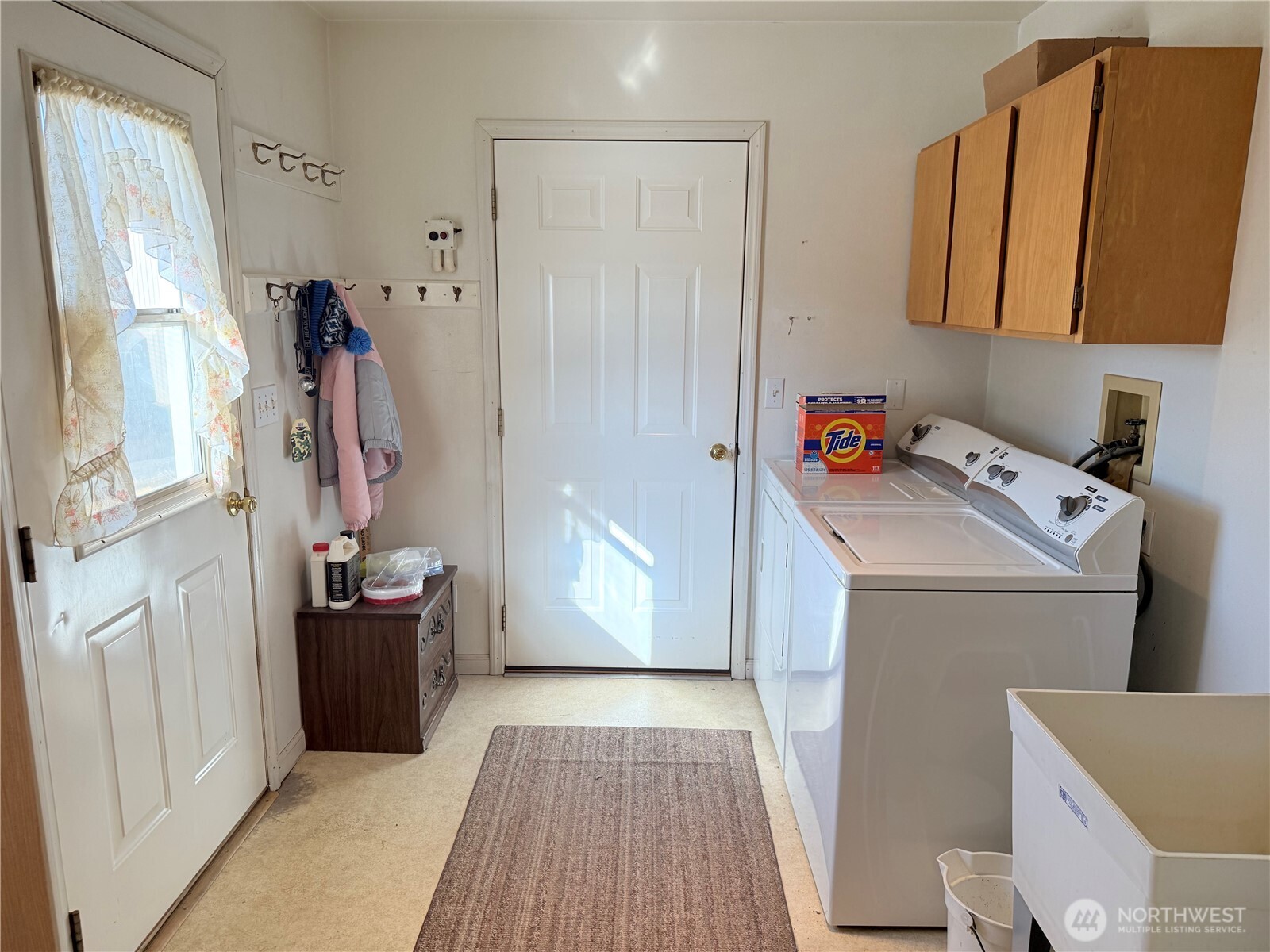 15977 Laney Bros Road East Odessa, WA 99159 - Photo 17 of 33 a view of storage and utility room with washer and dryer