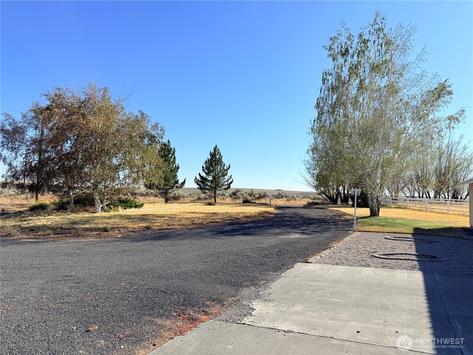 15977 Laney Bros Road East Odessa, WA 99159 - Photo 24 of 33 a view of swimming pool with an outdoor space and seating area