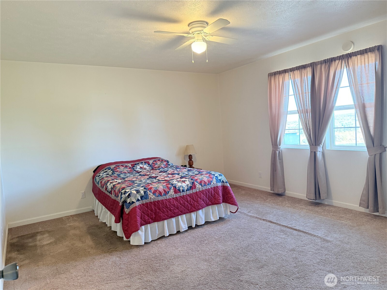15977 Laney Bros Road East Odessa, WA 99159 - Photo 6 of 33 a bedroom with a bed and a fan