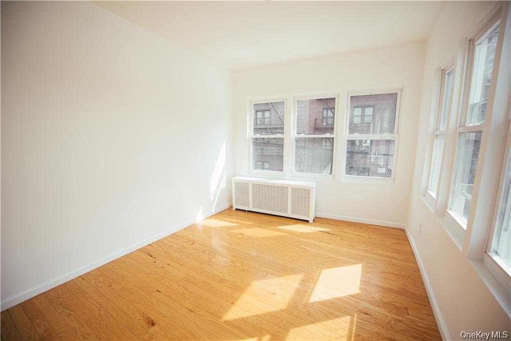 1443 Beach Avenue Bronx, NY 10460 - Photo 18 of 25 a view of an empty room with a window