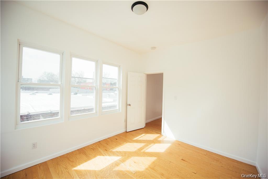 1443 Beach Avenue Bronx, NY 10460 - Photo 20 of 25 a view of an empty room with a window