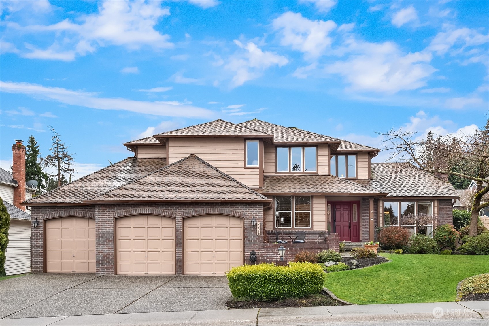 a front view of a house with garden
