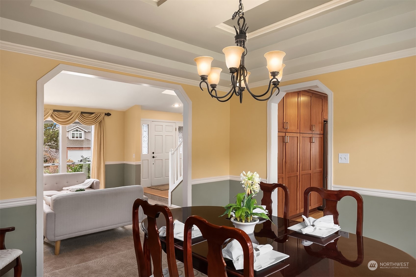 2224 237th Place Southeast Bothell, WA 98021 - Photo 11 of 40 a view of a dining room with furniture and a chandelier
