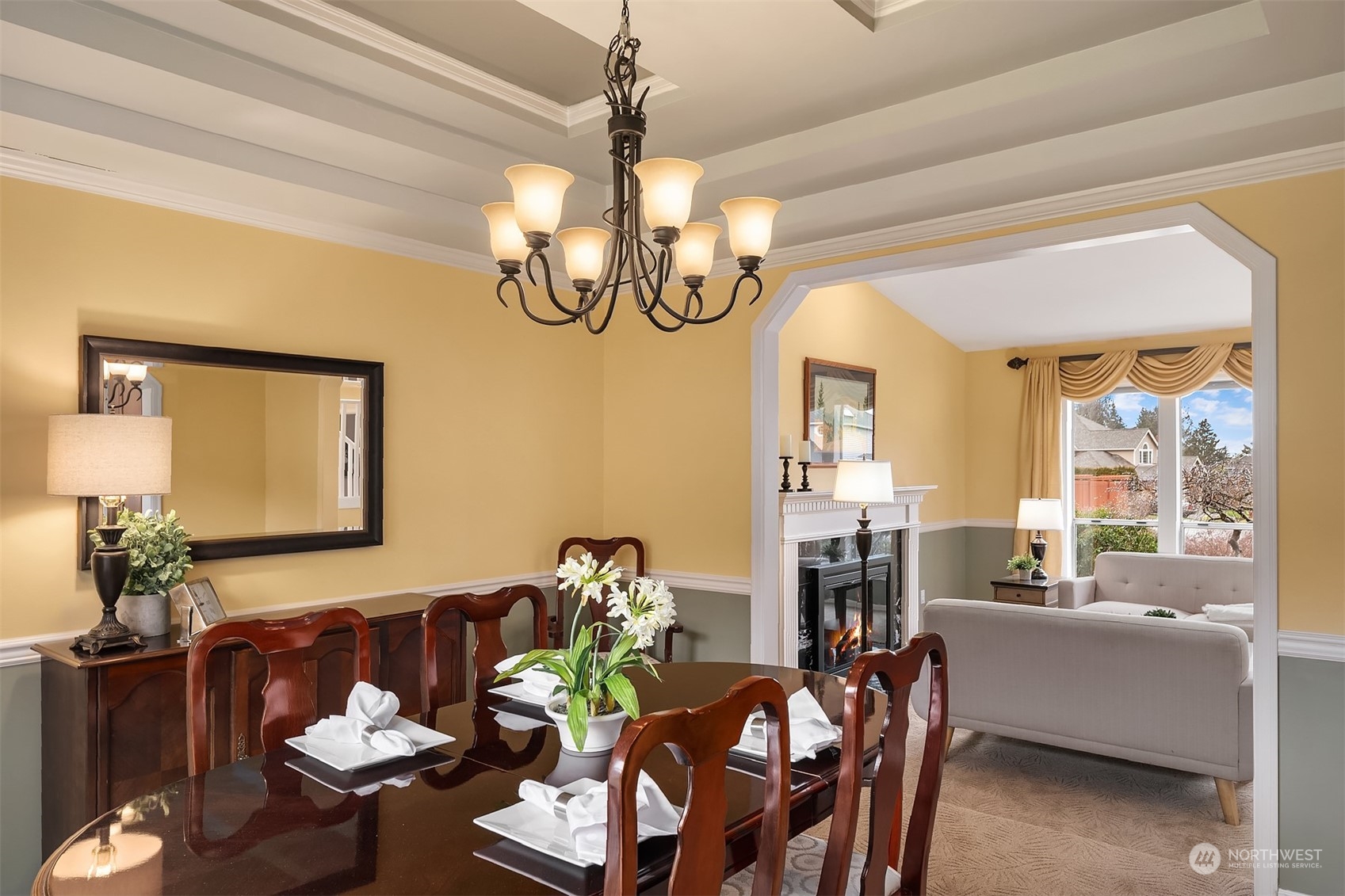 2224 237th Place Southeast Bothell, WA 98021 - Photo 12 of 40 a living room with dining table furniture a chandelier and a large mirror