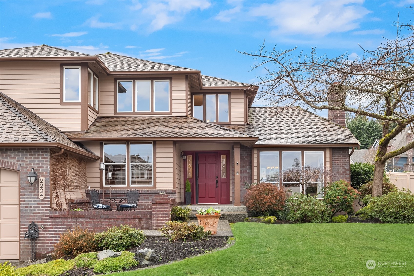 2224 237th Place Southeast Bothell, WA 98021 - Photo 2 of 40 a front view of a house with garden and porch