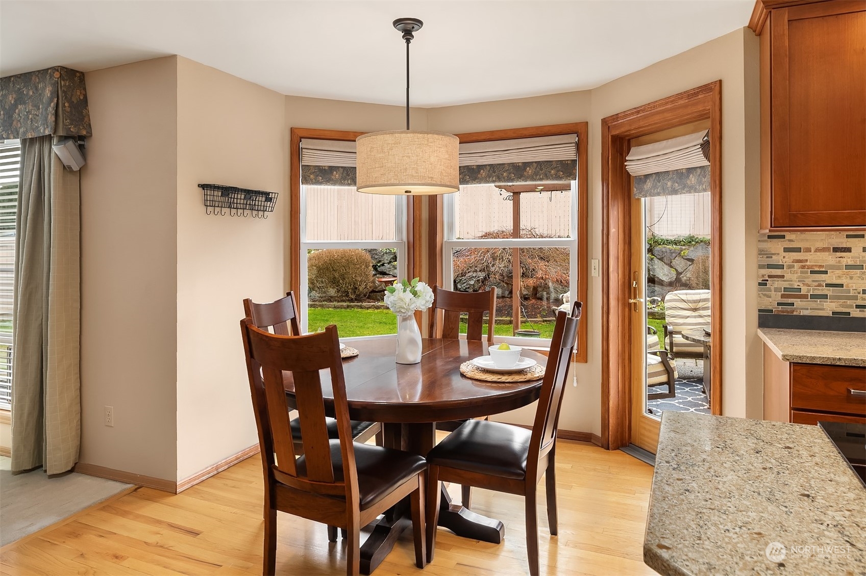 2224 237th Place Southeast Bothell, WA 98021 - Photo 24 of 40 a dining room with furniture a chandelier and wooden floor
