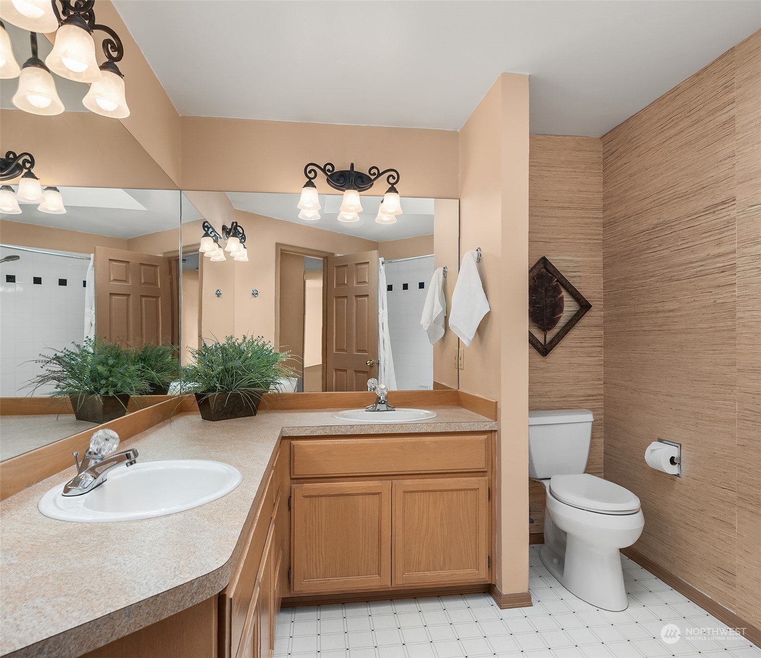 2224 237th Place Southeast Bothell, WA 98021 - Photo 34 of 40 a bathroom with a toilet sink and mirror