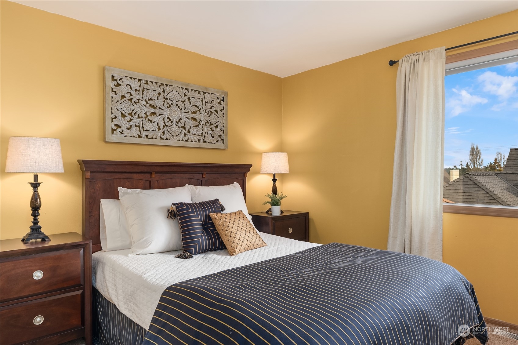 2224 237th Place Southeast Bothell, WA 98021 - Photo 35 of 40 a bedroom with a bed and a lamp on dresser