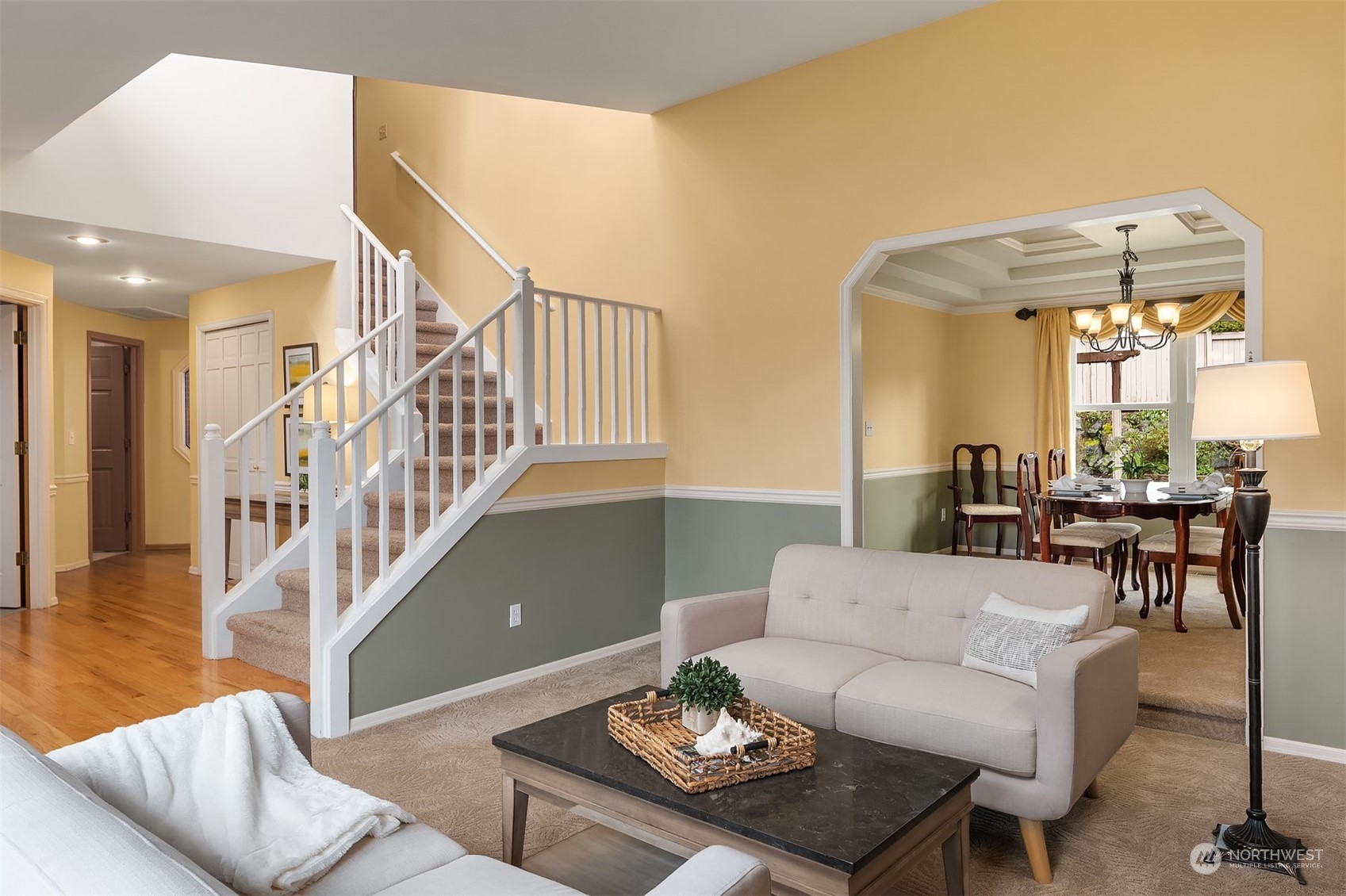 2224 237th Place Southeast Bothell, WA 98021 - Photo 8 of 40 a living room with furniture and a dining table with wooden floor