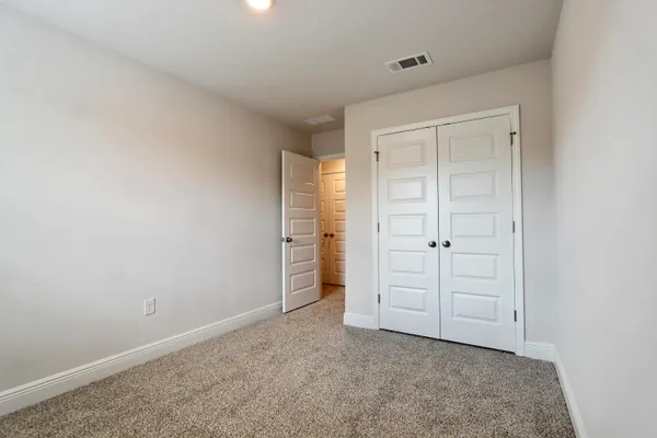 wooden floor and closet in a room