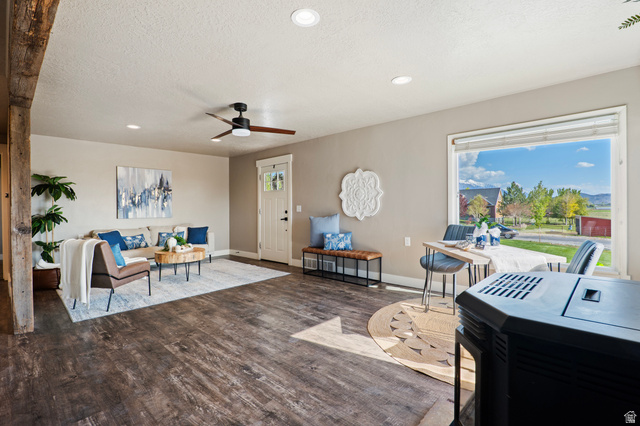 115 East 1600th Street North Santaquin, UT 84655 - Photo 7 of 52 Open concept living space featuring wood-finish flooring, recessed lighting, and a prominent picture window