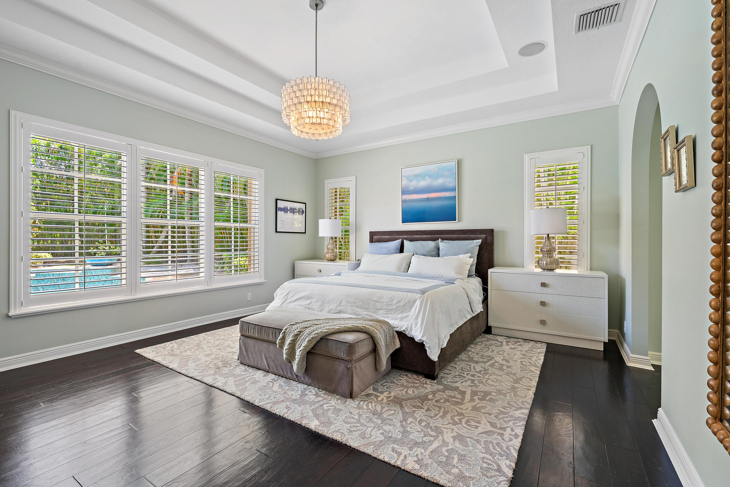 105 Segovia Way Jupiter, FL 33458 - Photo 13 of 33 a spacious bedroom with a bed and a large window