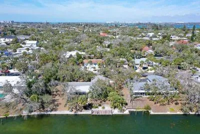 an aerial view of a house with a lake view