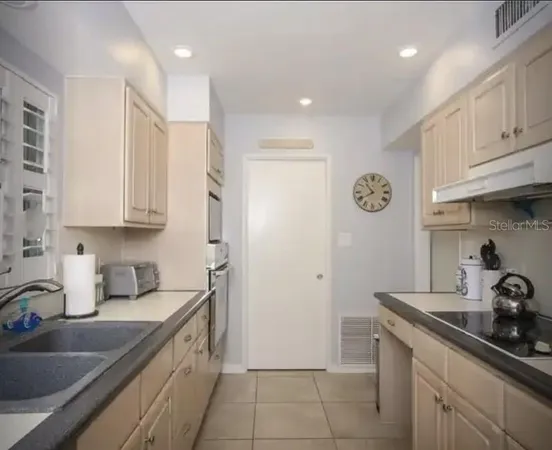 a bedroom with a balcony a bed and a couch