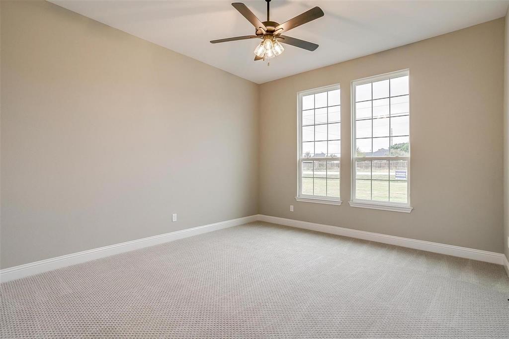 2316 Builder Road Crowley, TX 76036 - Photo 19 of 34 an empty room with a window and a fan