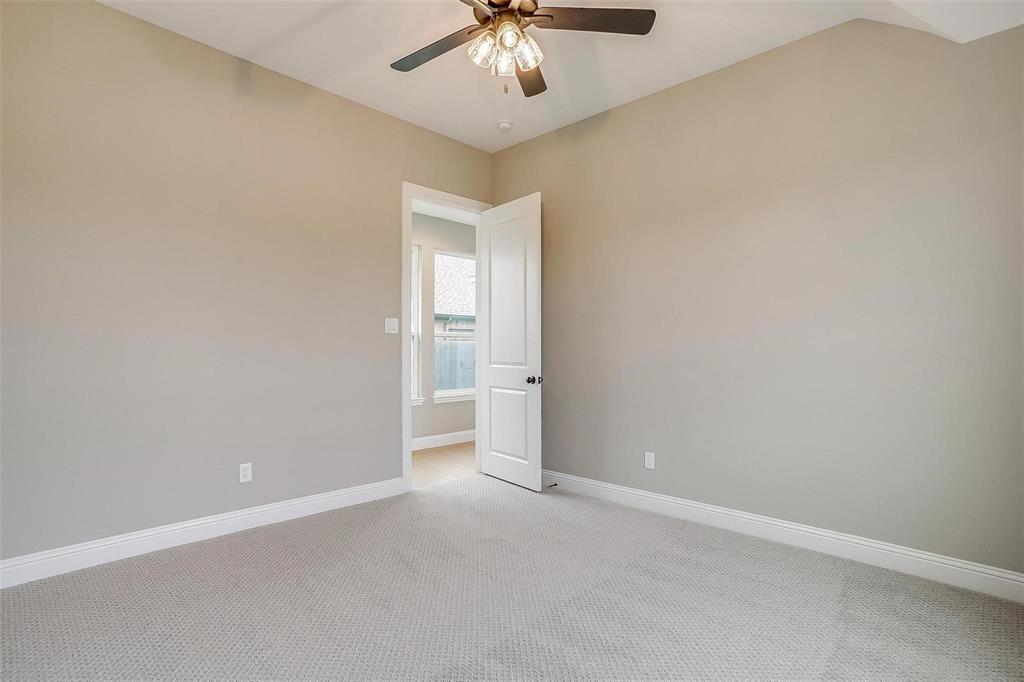 2316 Builder Road Crowley, TX 76036 - Photo 22 of 34 an empty room with a chandelier fan