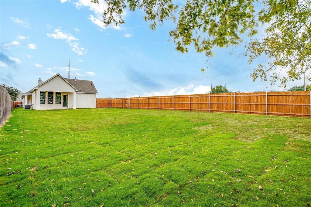 2316 Builder Road Crowley, TX 76036 - Photo 32 of 34 a view of garden with plants and wooden fence