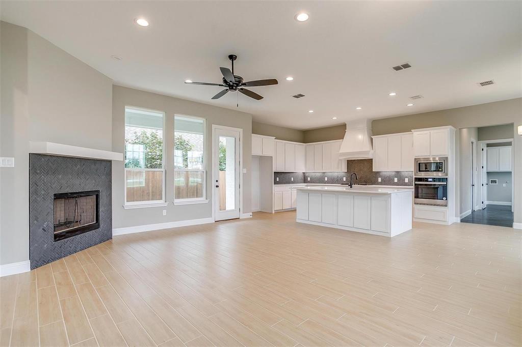 2316 Builder Road Crowley, TX 76036 - Photo 6 of 34 a view of kitchen with refrigerator and microwave