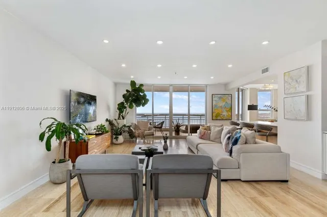 a view of a building with a garden and plants