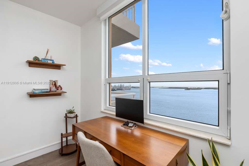 808 Brickell Key Drive, Unit 2504 Miami, FL 33131 - Photo 23 of 26 a room with furniture and a window