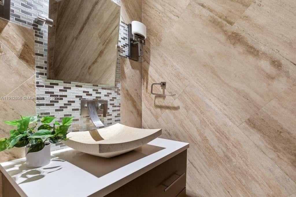 808 Brickell Key Drive, Unit 2504 Miami, FL 33131 - Photo 26 of 26 a vase of flowers sitting on a table