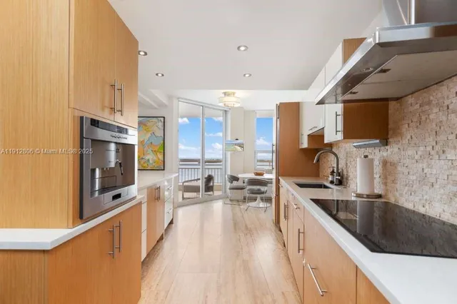 a living room with furniture potted plant and a window