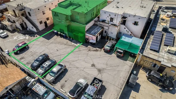 an aerial view of a backyard with chairs