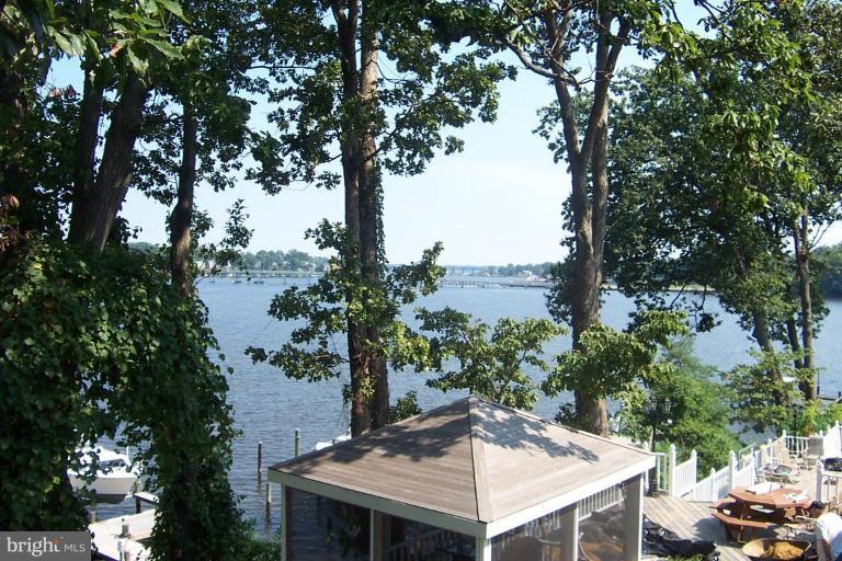 218 Park Road Riva, MD 21140 - Photo 4 of 4 a view of a patio with furniture and a lake view