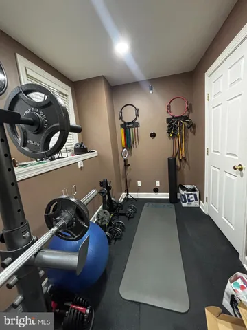 a room with furniture and gym equipment