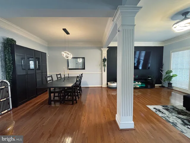 a view of a living room and dining room