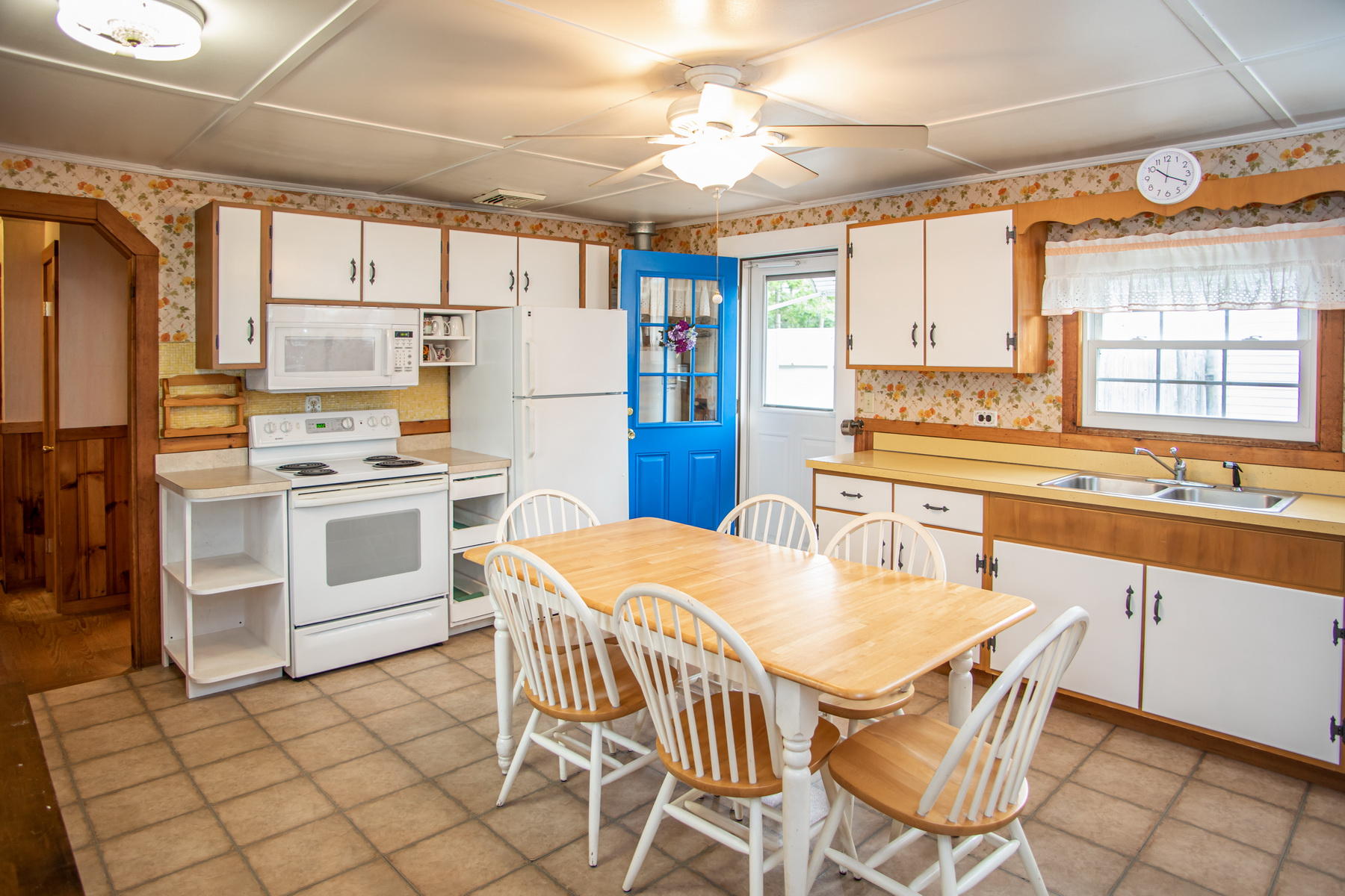 73 Uncle Rolf Road Dennis Port, MA 02639 - Photo 11 of 23 a kitchen with stainless steel appliances a stove a sink cabinets and a window