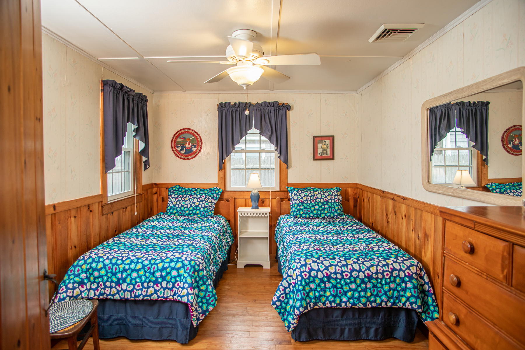 73 Uncle Rolf Road Dennis Port, MA 02639 - Photo 14 of 23 a bedroom with two beds and a chandelier