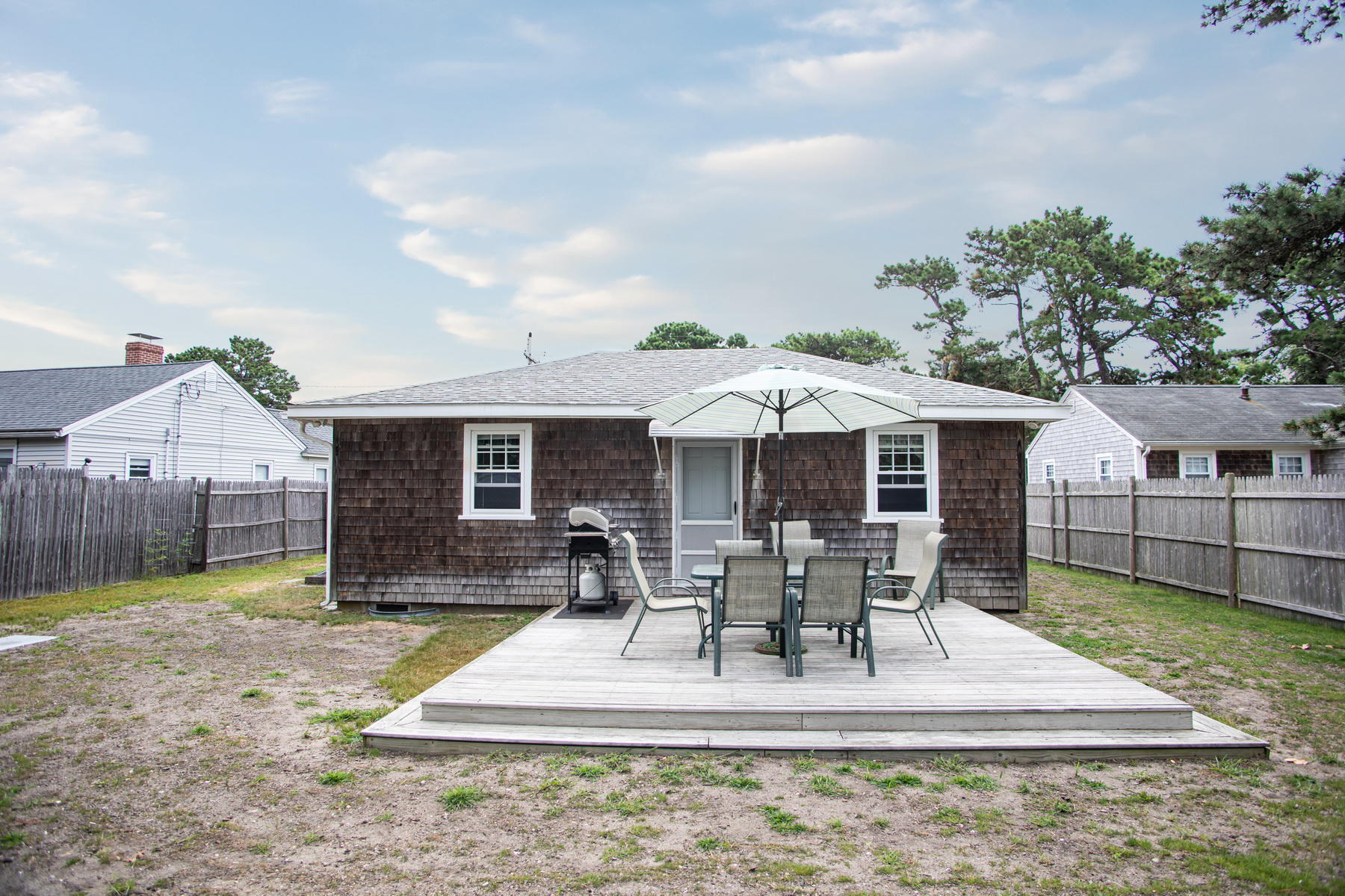 73 Uncle Rolf Road Dennis Port, MA 02639 - Photo 23 of 23 a view of a house with backyard porch and sitting area