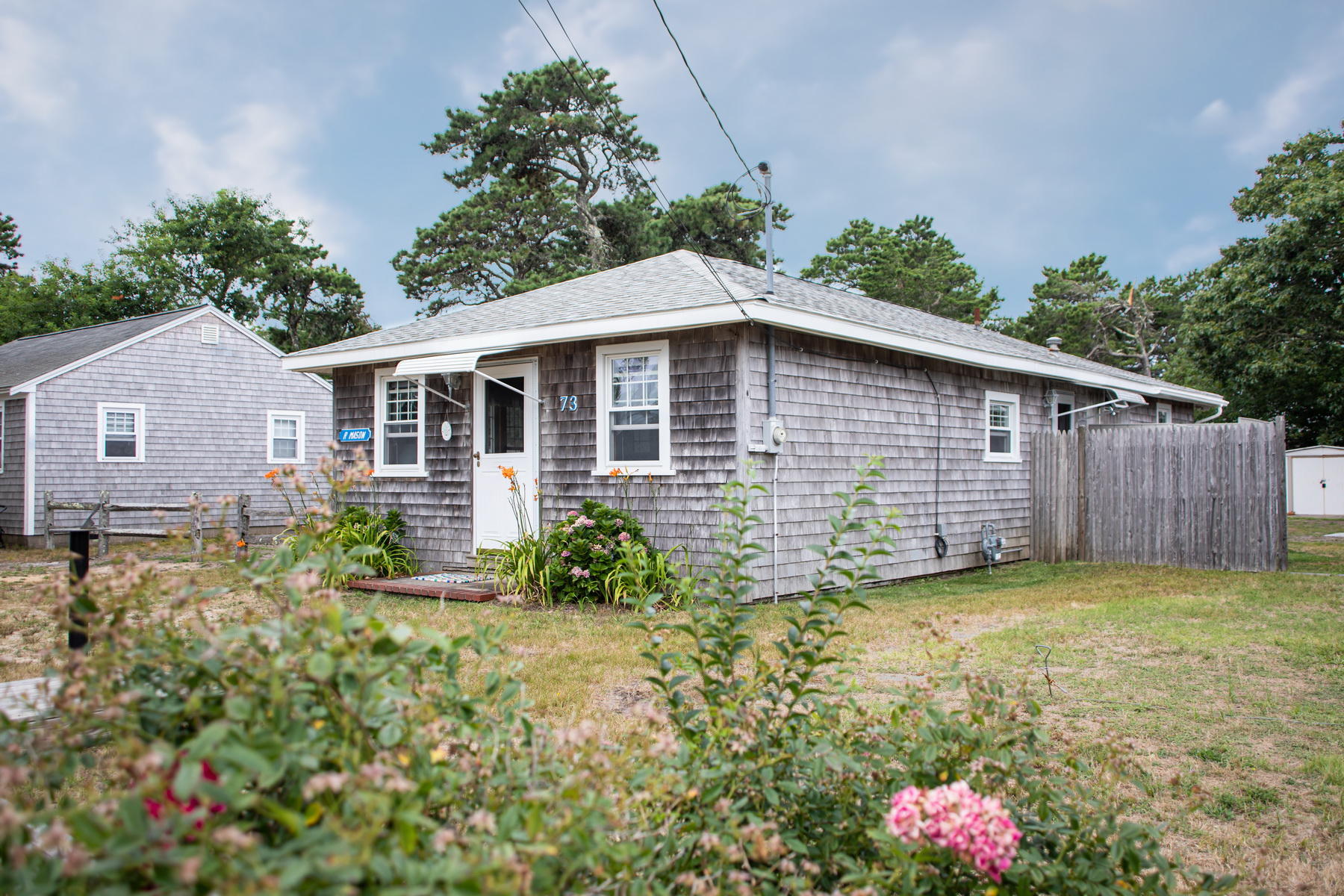 73 Uncle Rolf Road Dennis Port, MA 02639 - Photo 5 of 23 a view of a house with a yard