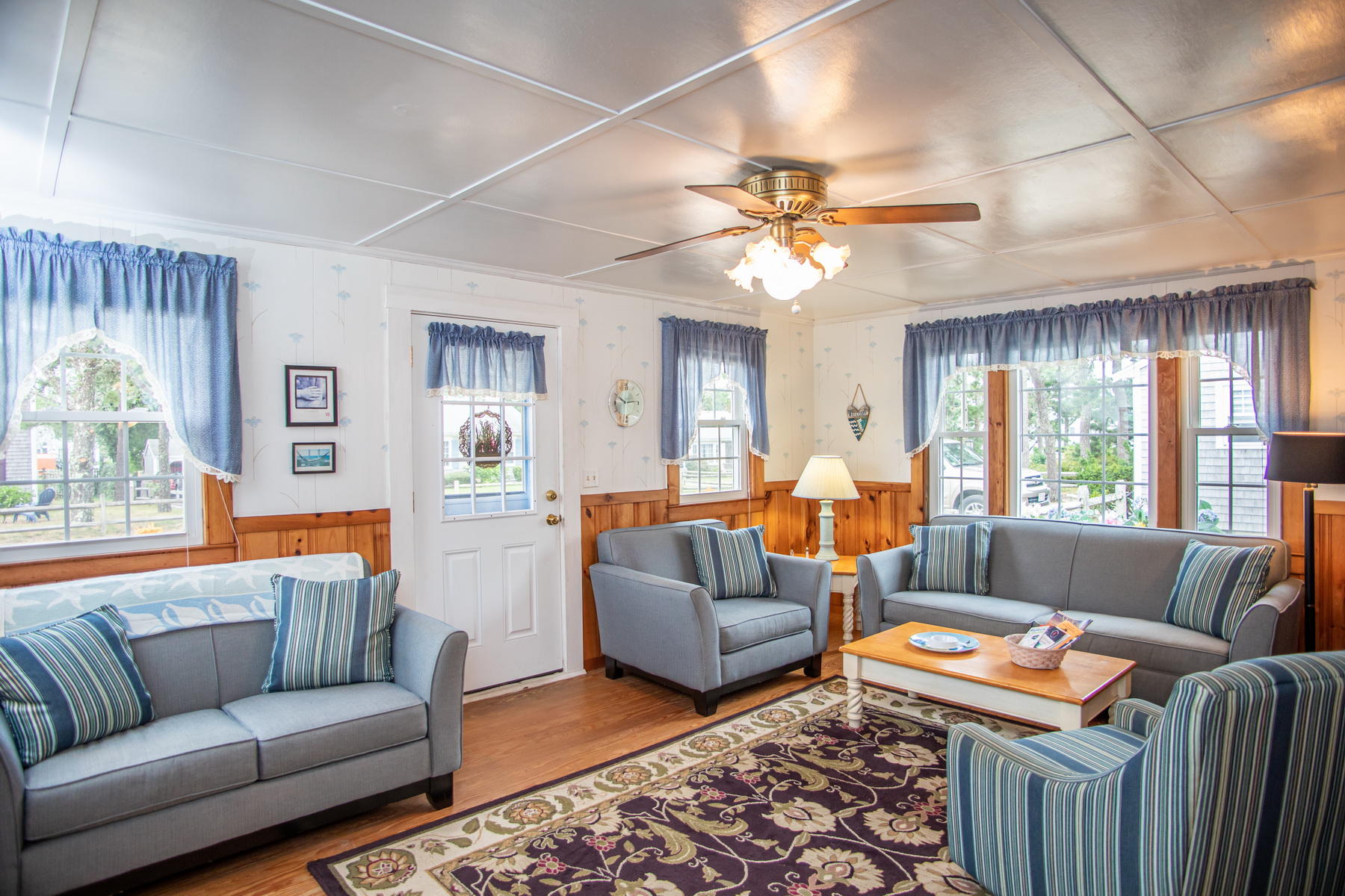 73 Uncle Rolf Road Dennis Port, MA 02639 - Photo 7 of 23 a living room with furniture ceiling fan and a window