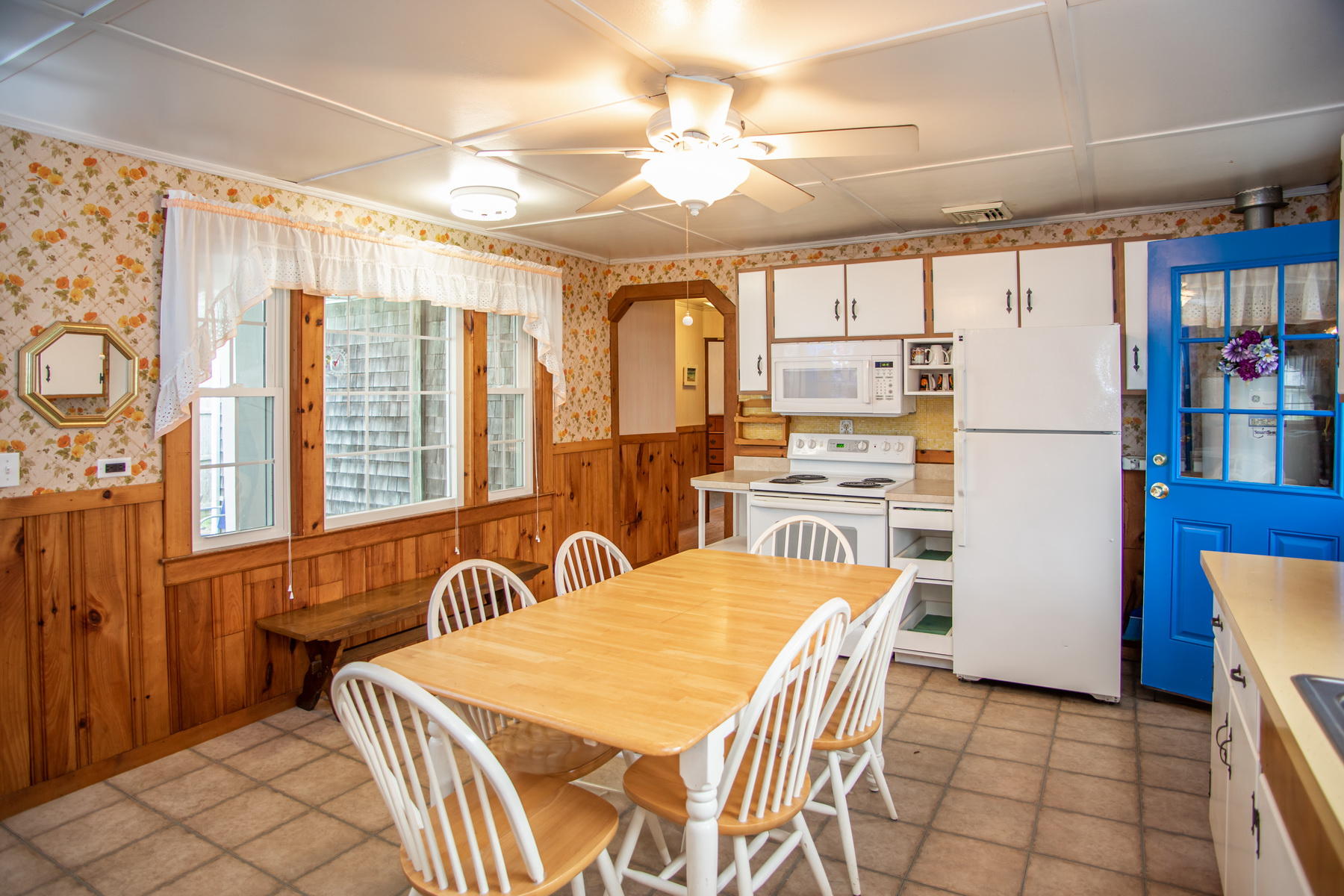 73 Uncle Rolf Road Dennis Port, MA 02639 - Photo 10 of 23 a kitchen with stainless steel appliances granite countertop a refrigerator a stove a sink dishwasher and white cabinets with wooden floor