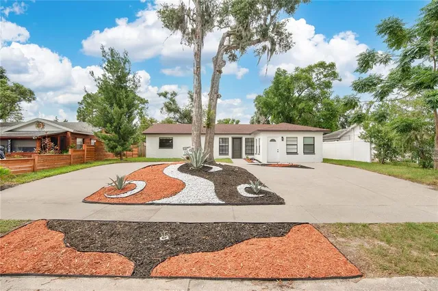 a view of a house with roof deck and sitting area