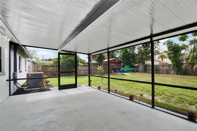 a backyard of a house with lots of green space and fountain