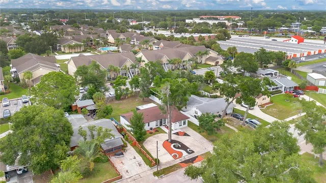 an aerial view of residential houses with outdoor space