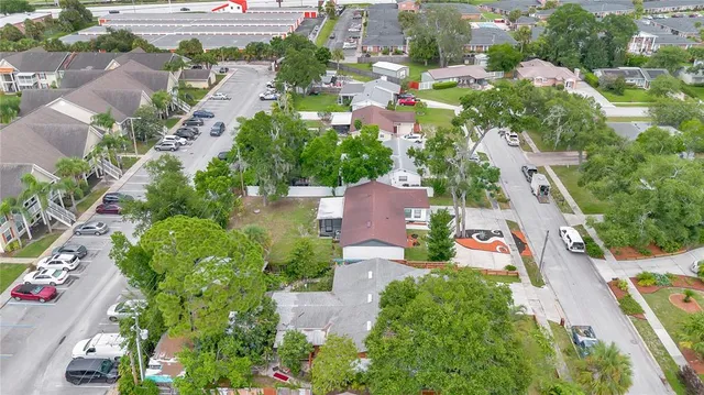 an aerial view of residential houses with outdoor space
